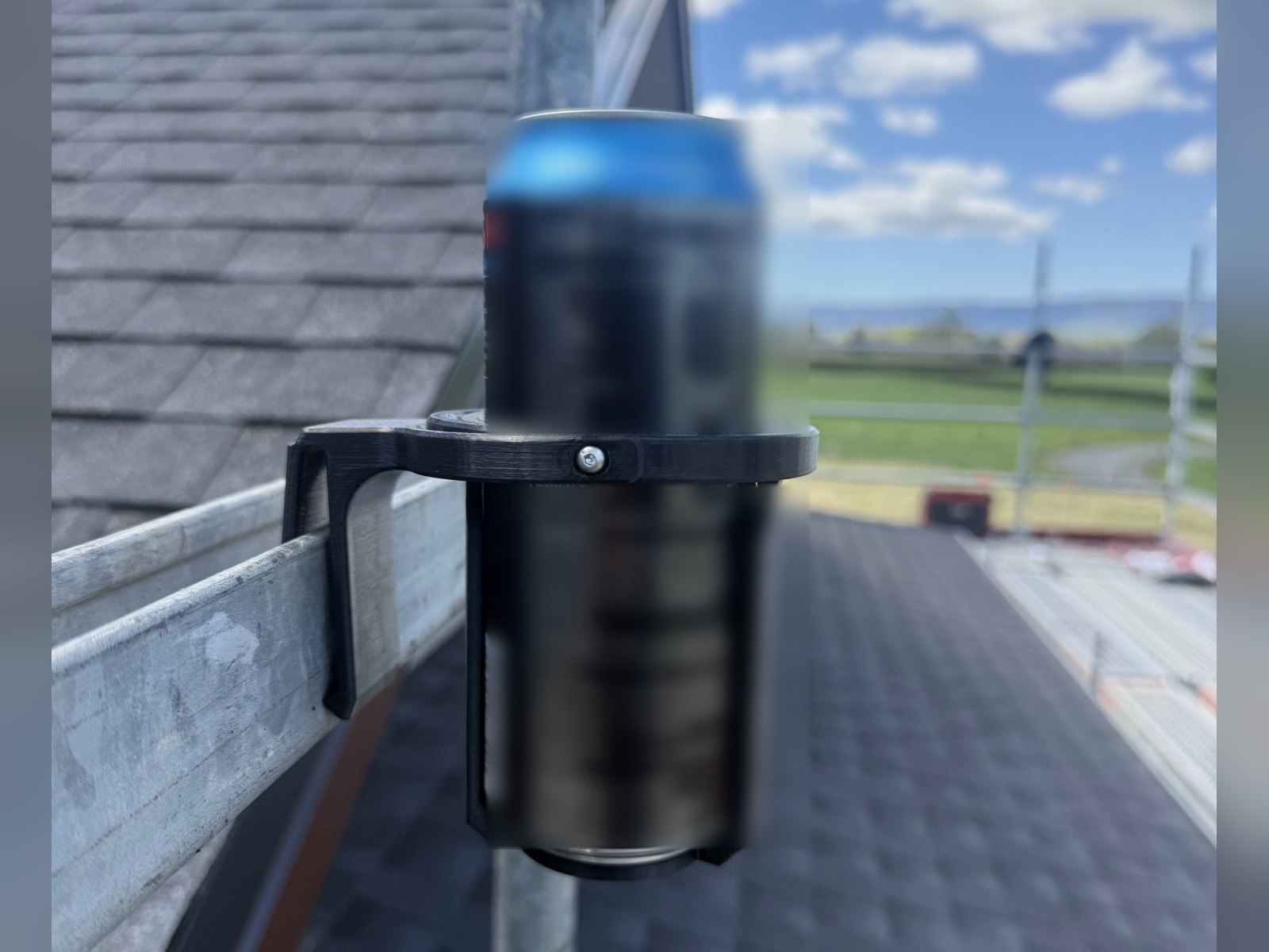 Clipcan Tool Belt clipped onto a scaffold rail on a roof