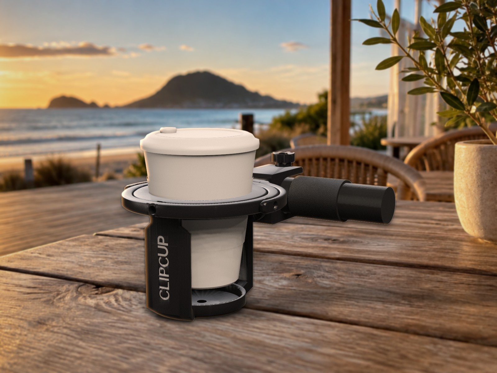Clipcup Pushchair holding a takeaway coffee on a café table by the beach